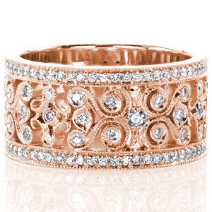 Gorgeous rose gold wedding band in Calgary features unique filigree scroll designs set with micro pave diamonds. 