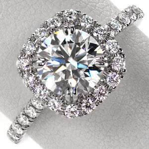 Hastings halo engagement ring with cushion shaped halo with round brilliant center stone.
