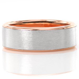 The modern and timeless look of this band offers clean lines and contrasting warm and cool tones. Fabricated in 14k rose gold and platinum, this design features soft high polish edges along with a satin finish center. This two tone look adds a unique quality to this classic design.
