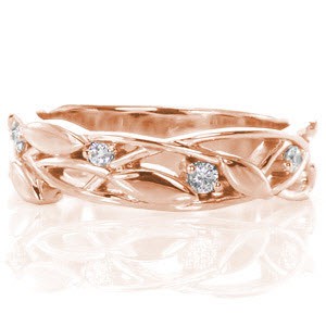Beautiful rose gold wedding band in Hartford. This band features a leaf and vine texture interspersed with small round brilliant diamonds.