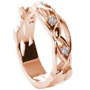 Salt Lake City floral inspired rose gold wedding band features an asymmetrical rose gold design of vines and leaves. Small diamonds are set between the pattern. 