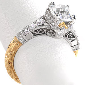 Stunning custom filigree engagement rings in Los Angeles with a two-tone yellow gold and platinum band. This unique, custom antique engagement ring style features micro pave diamonds, relief hand engraving, and delicate hand formed filigree curls.
