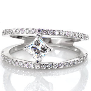 Des Moines split shank engagement ring with kite-set princess cut center stone and diamond band.