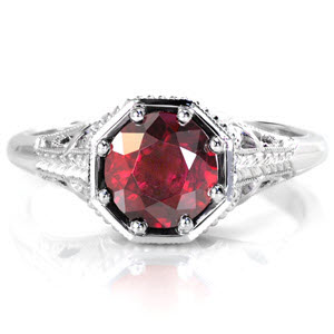 The vivid 1.50 ct. red ruby is showcased in a unique octagonal setting and is held in place with eight bead set prongs for security and detail. Pierced patterns are accented in milgrain texture and a smooth high polish for a striking contrast. The hand engraved wheat pattern adds to the antique feel or this design.  