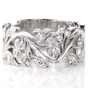 Design 2837 is a gorgeous wide band formed from gracefully intertwining leaves and vines. Small diamonds are set among the the leaves on the top section of the band to add flashes of radiant light. All of the edges are carefully hand detailed with milgrain texture.