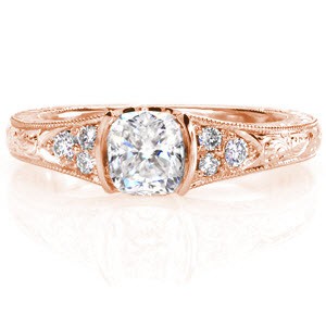 Antique engagement ring in Quebec with a cushion cut center stone set in a half bezel.
