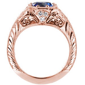 Charleston custom rose gold engagement ring with a knife edge band and octagonal central bezel holding a round blue sapphire.