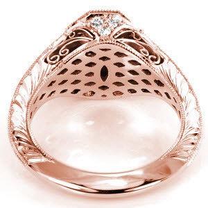 Dallas custom rose gold engagement ring with a knife edge band and octagonal central bezel holding a round blue sapphire.