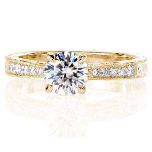 Bridgeport custom engagement ring with a tapering bead set diamond and milgrain band leading to a round diamond center stone.