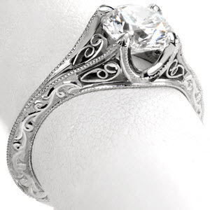 Filigree engagement ring in Cleveland with scroll relief engraving and round center stone.