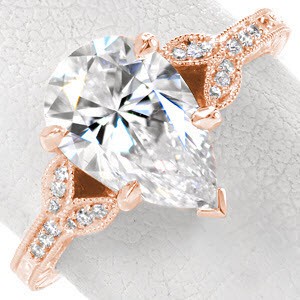 Rose gold engagement ring in Houston with pear center stone, delicate petals and milgrain border.
