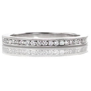 The Vita .25 is a classic wedding band that will pair beautifully next many engagement ring styles. From a contemporary solitaire to modern halo this channel set diamond band gives just the right amount of sparkle. Milgrain texture details the edges of the channel adding brightness to the white gold metal.