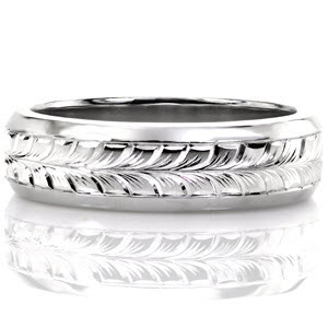 This hand engraved men's band is featured in 14k white gold with high polished, beveled edges. The middle of the band has been masterfully hand engraved with a full wheat pattern. The engraved lines are used to create depth and movement in the design. This design can be customized with a different engraving pattern.