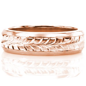 This hand engraved men's band is featured in 14k white gold with high polished, beveled edges. The middle of the band has been masterfully hand engraved with a full wheat pattern. The engraved lines are used to create depth and movement in the design. This design can be customized with a different engraving pattern.