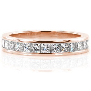 Contemporary channel set rose gold stacking band in Fort Worth. This elegant band is made with channel set princess cut diamonds for a clean, modern ring design.