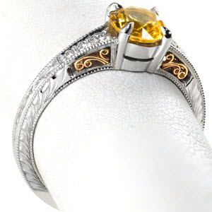 Unique yellow sapphire two tone engagement ring in Milwaukee. This vintage engagement ring style is stunning with a yellow sapphire center stone and yellow gold filigree curls.