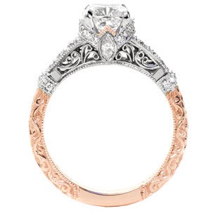 Rose gold cushion cut engagement ring features a stunning collection of rose gold antique engagement ring inspiration in Hartford. The Haley Allison is shown as a two-tone with white and rose gold. A relief style, hand engraved scroll pattern decorates the rose gold band while micro pave diamonds and hand formed filigree curls adorn the top.