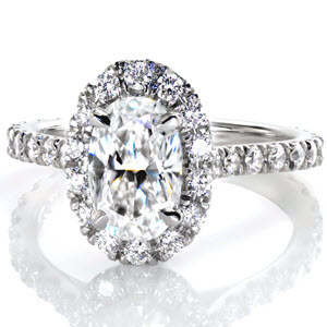 Oval engagement ring in San Diego with diamond band and white gold setting.