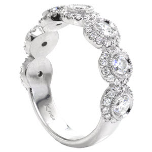 San Antonio unique wedding band with seven bezel set diamonds surrounded by, milgrain, and diamond halos.