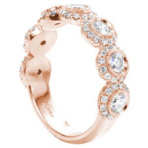 Colorado Springs rose gold wedding ring with seven diamond halos.