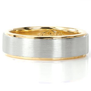 Gent's two-tone band is custom created in 18k yellow gold and platinum. High polish rails outline outer edges of the band in yellow gold. A brushed finish is applied to the platinum center for a unique contrast. The Design also features a personalized insert panel.  
