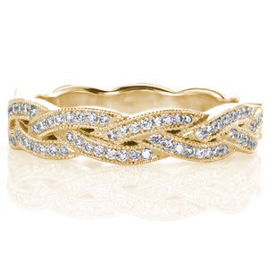 Custom wedding ring in Ann Arbor with a unique bead set diamond and milgrain edged braid design.