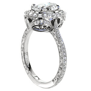 Victoria custom engagement ring with a unique antique inspired basket design topped with a diamond halo and a oval cut center diamond.