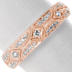 Star burst patterned rose gold wedding band in Seattle, Washington. This micro pave wedding ring is shown in rose gold for a captivating look.