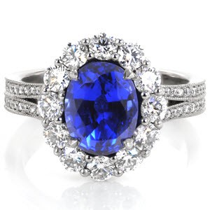 Royal inspired halo engagement ring in Cincinnati. This stunning antique styled ring features a blue oval sapphire center. The split shank band and basket under the halo are all adorned with brilliant micro pave diamonds.