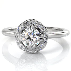 Custom engagement ring in Providence with a unique antique inspired halo surrounding a round diamond center stone.