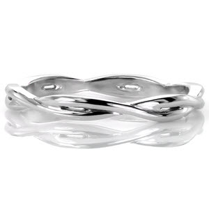 Design 3050 gracefully weaves two high polished bands into one throughout the whole ring. Crafted in 14k white gold, the overlapping bands adds dimension and open pockets to sections of the ring. The woven pattern complements a variety of engagement ring styles or can fashionably be worn on its own.