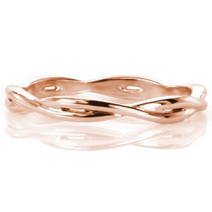 Design 3050 gracefully weaves two high polished bands into one throughout the whole ring. Crafted in 14k white gold, the overlapping bands adds dimension and open pockets to sections of the ring. The woven pattern complements a variety of engagement ring styles or can fashionably be worn on its own.