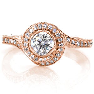 Custom engagement ring with a unique twisting diamond halo surrounding a round brilliant center stone in Ann Arbor.