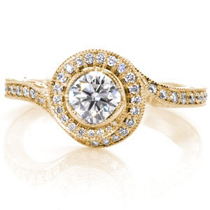Custom engagement ring with a unique twisting diamond halo surrounding a round brilliant center stone in Riverside.