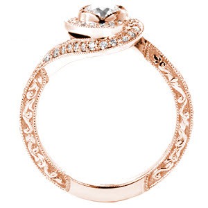 Rose gold halo engagement ring in Orlando is a stunning custom design. This unique rose gold engagement ring features a twisted halo with a micro pave band and relief style engraving.