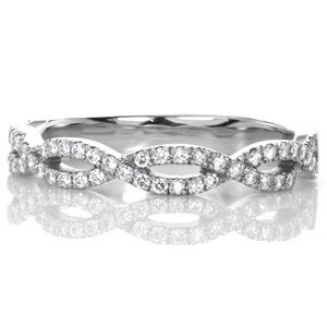 Design 3118 creates dazzling visual appeal with its interwoven bands of diamonds. The scalloped sides of this contemporary wedding band create an elegant sense of motion. This design can easily be customized in white, rose, or yellow gold, or in 950 ruthenium platinum. 