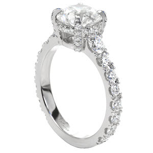 Custom classic engagement ring with a round center diamond held by four diamond set prongs atop a graduating diamond band in Indianapolis.