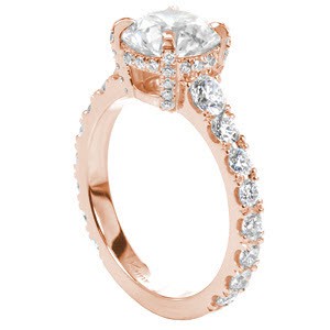 Custom rose gold classic engagement ring with a round center diamond held by four diamond set prongs atop a graduating diamond band in Indianapolis.