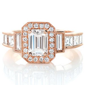 Stunning art deco halo engagement ring in rose gold. This gorgeous design features an emerald cut center diamond with a halo and step-cut diamond sides. The carre cut diamonds and baguettes really add to the vintage art deco feel of this custom halo engagement ring.