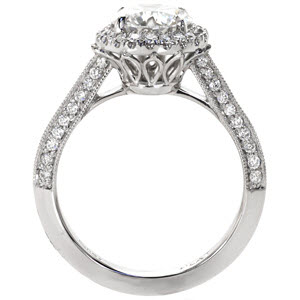 Custom engagement ring in Riverside with a unique pierced undercarriage topped with a halo framed round center diamond.