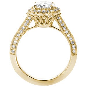 Custom engagement ring in Arlington with a unique pierced undercarriage topped with a halo framed round center diamond.