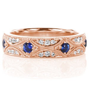 Detroit custom band with an intricate pattern of bead set diamonds and blue sapphire outlined with milgrain edging.