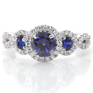 Washington D.C. halo engagement ring with three blue sapphires and woven band.
