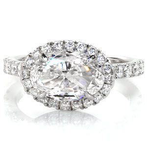 Des Moines custom engagement ring with u-cut micro pave diamonds surrounding a horizontal set oval center.