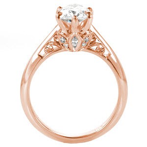 Unique solitaire engagement ring custom created around an oval diamond center held by six prongs with a floral and filigree design profile in West Valley City.