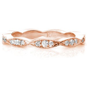 Design 3231 is an elegant scalloped piece that works great as a fun ring, part of a stacker set, or as a wedding band. The beaded milgrain texture along the edges of the band creates a cohesive whole with the beadset round diamonds. High polished sides show off the beautiful luster of the metal. 