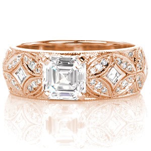 Stunning rose gold engagement ring in St. Louis features a wide band. This rose gold design uses start burst patterns and micro pave diamonds to provide a regal look.