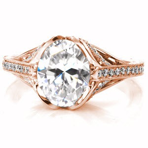 Grand Rapids custom created rose gold engagement ring with antique inspired details including center petal prongs holding an oval center and arching bead set diamonds.