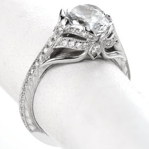Custom oval engagement ring featuring antique engagement ring details in Miami. This unique ring features micro pave diamonds along with bezel set surprise diamonds on a hand engraved band. 