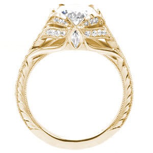 Fargo custom created engagement ring with antique inspired details including center petal prongs holding an oval center and arching bead set diamonds.